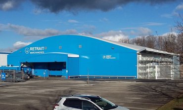 Bâtiment démontable pour la distribution